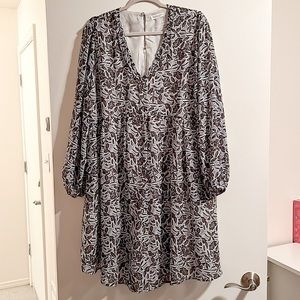 Blue floral 3/4 sleeve dress. Deep V ruffle neck. Size 1X.